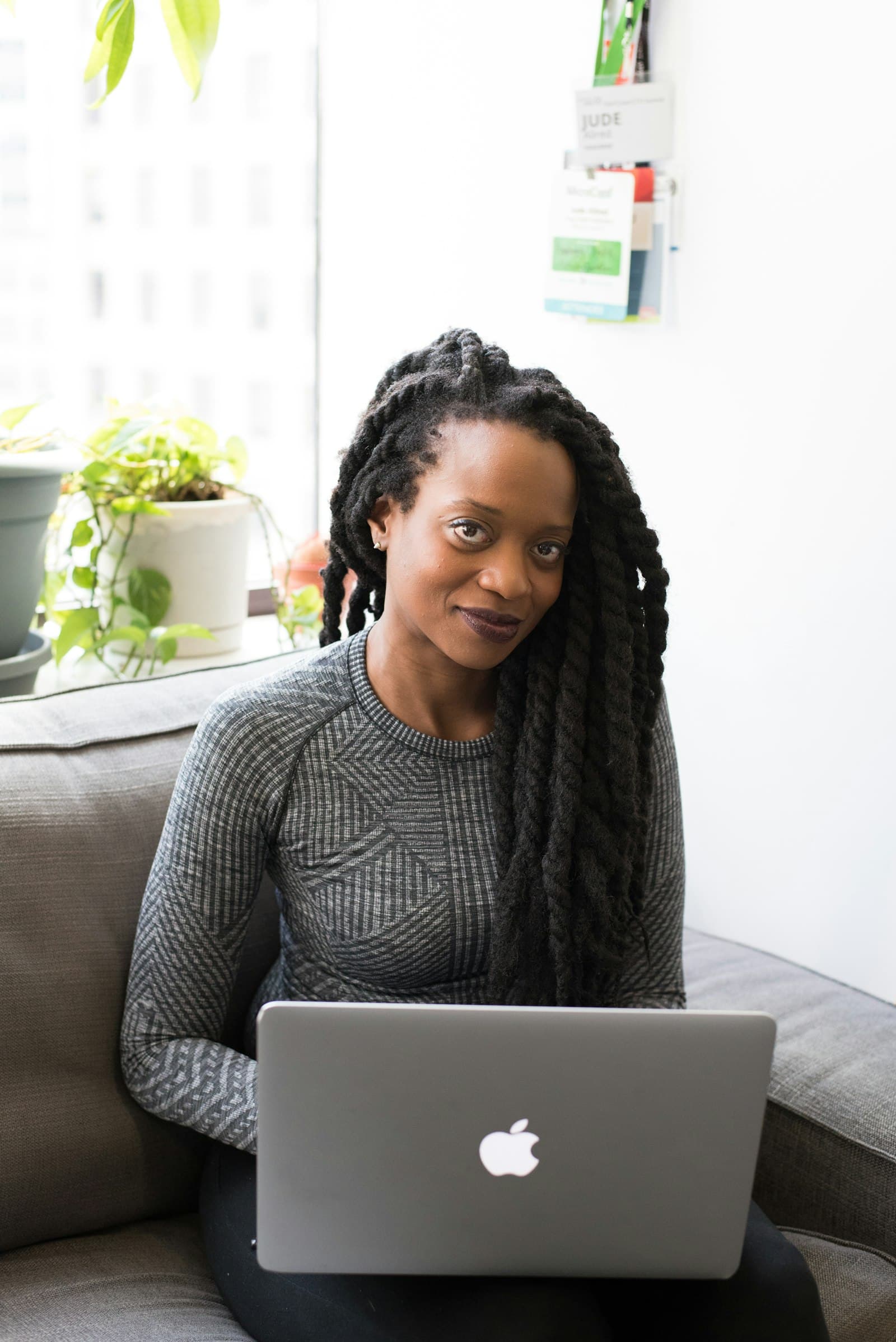 Woman working on a laptop in a relaxed office setting